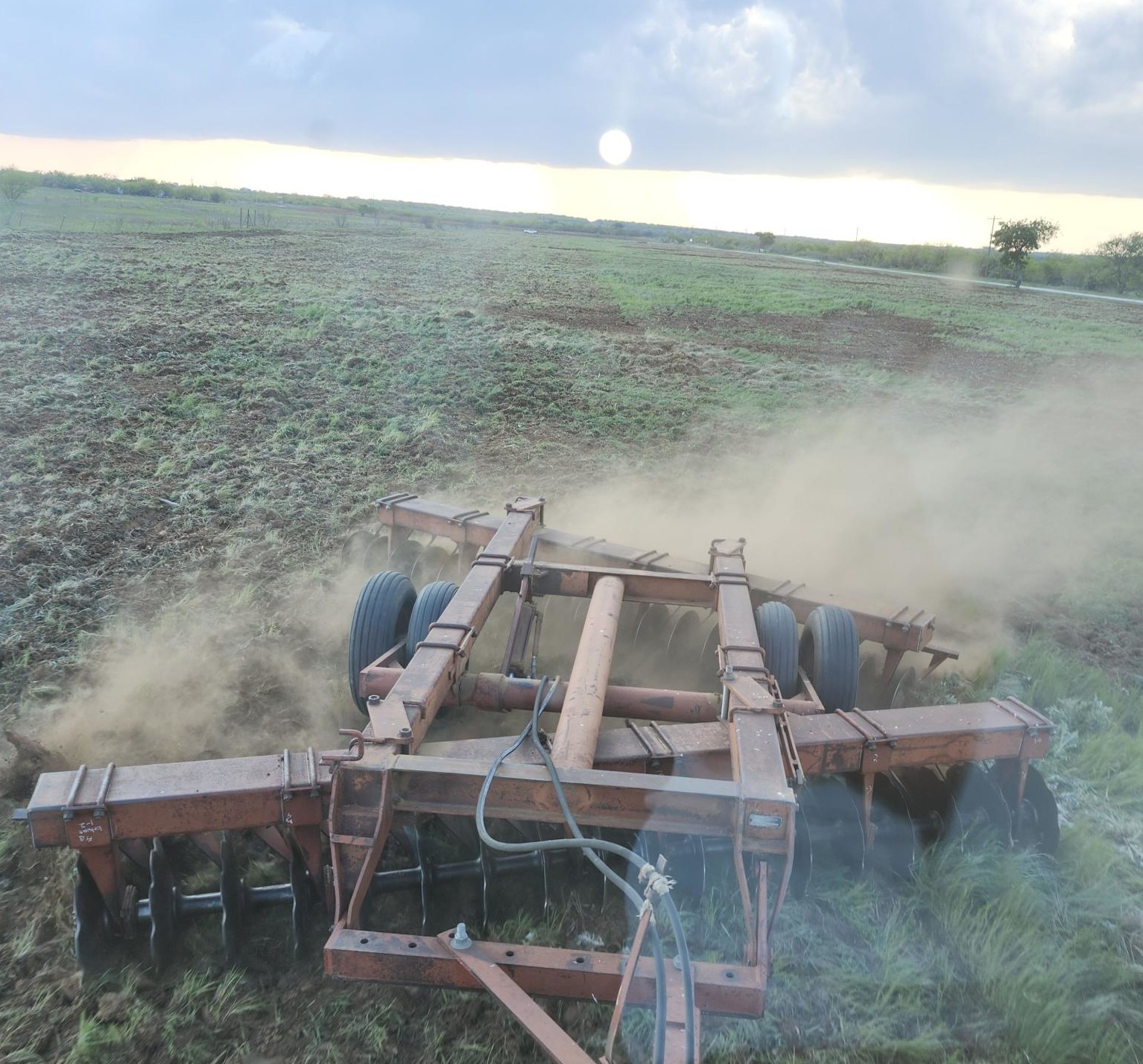 Field implement working ryegrass in North Central Texas